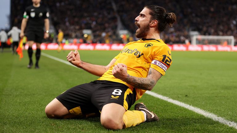 Ruben Neves celebrates after scoring Wolves&#39; third goal against Liverpool